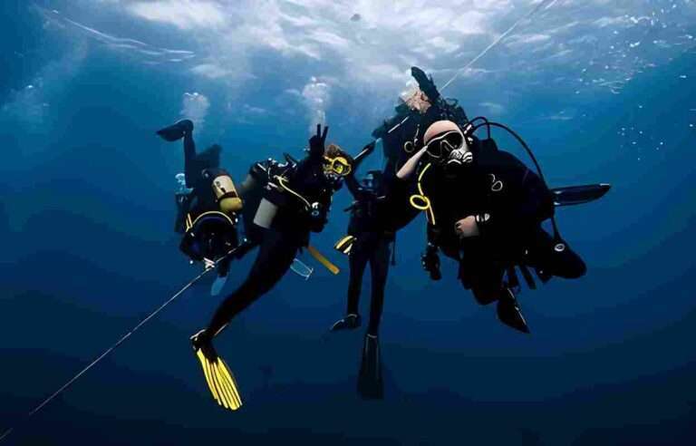 Scuba diver with full gear exploring vibrant coral reef underwater